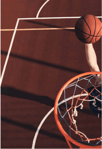Basketball hoop with man dunking on it