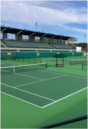 Luxury pickleball courts with spectator seating and shock-absorbing playing surfaces.