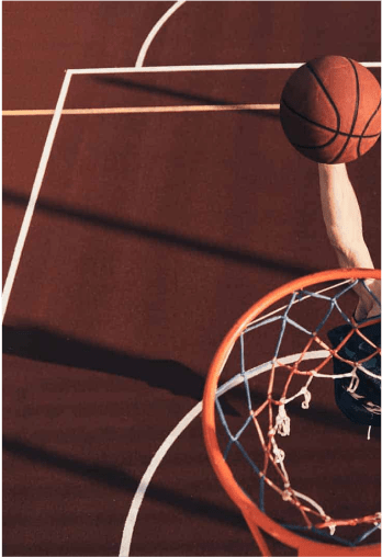 Man dunking on CourTex basketball hoop