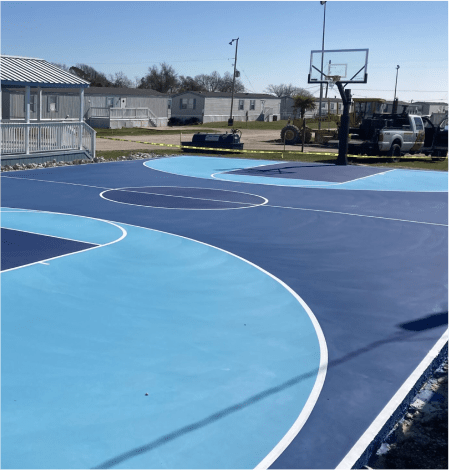 Full-court basketball setup with professional-grade flooring and high-performance hoops.