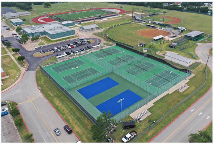 The befpre image of poorly maintained tennis courts, before CourTex resurfaced them.